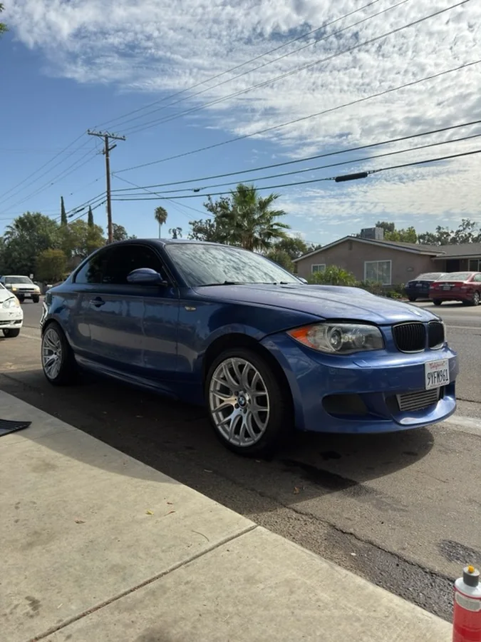 Blue BMW coupe after an exterior detail in Tulare, CA